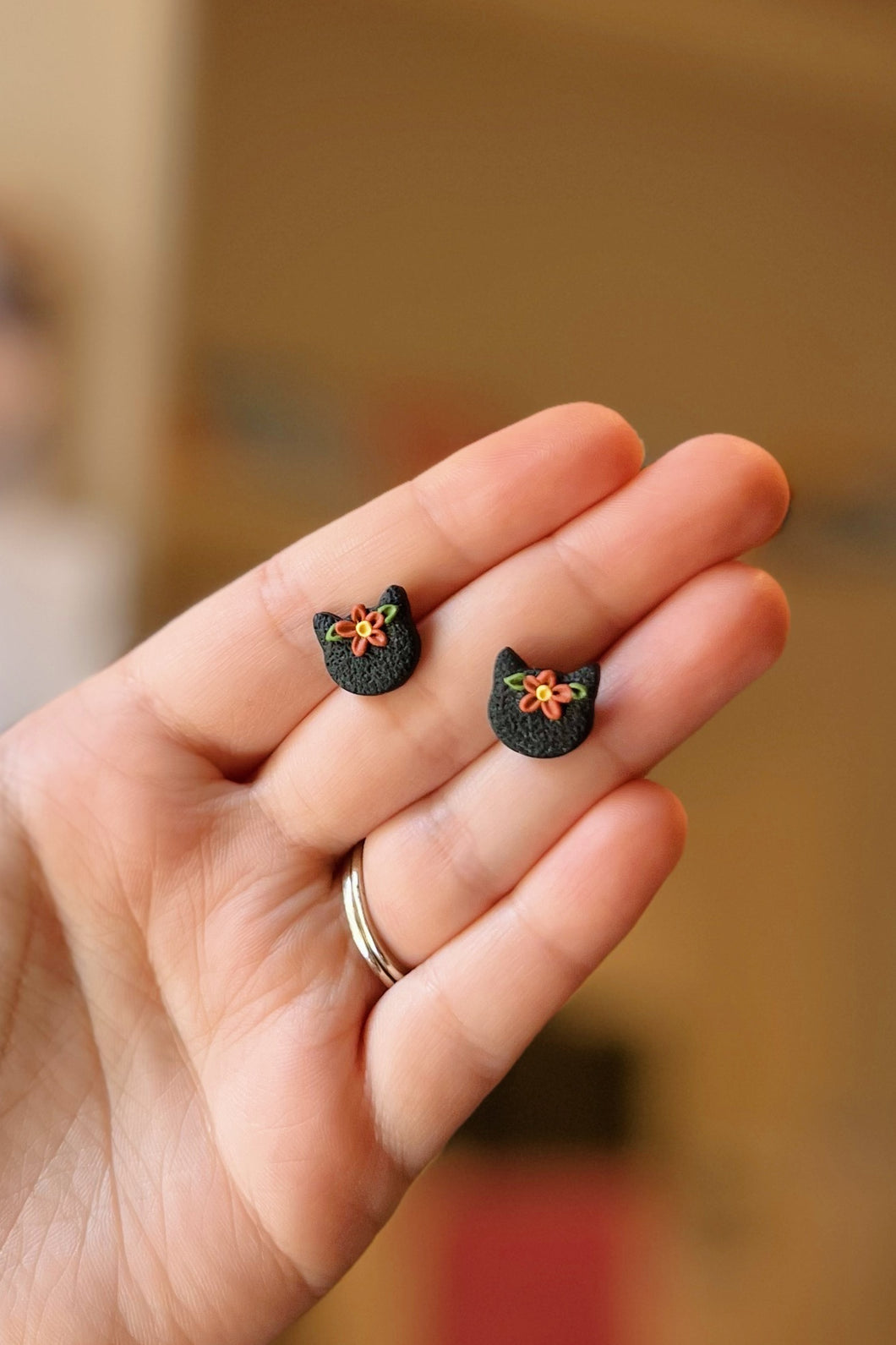 floral black cat studs